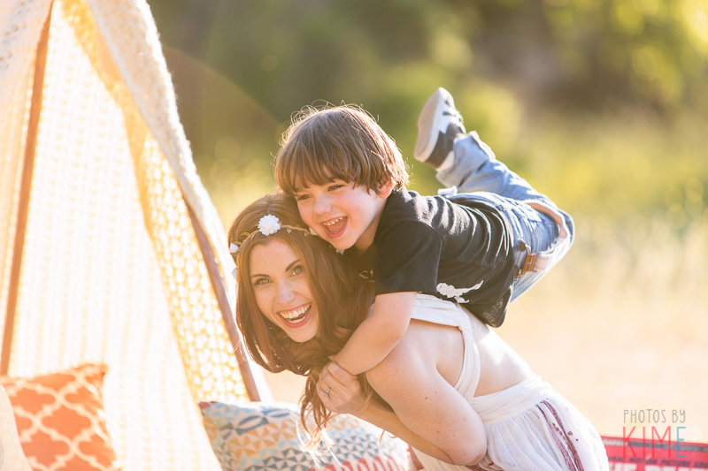 photos by kim e - san jose photographer - family session at rancho san antonio - sunset - rustic - family session - golden hour  - mom and son posing - playful