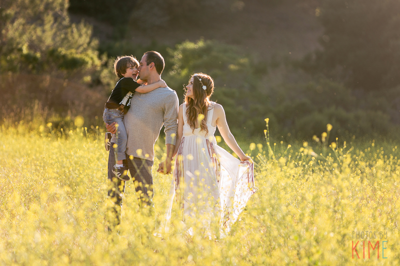 photos by kim e - san jose photographer - family session at rancho san antonio - sunset - rustic - family session - golden hour - family of three pose - field of flowers - rustic - bohemian 