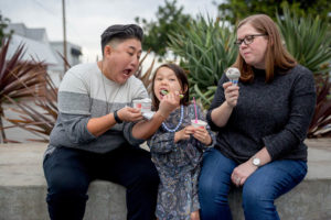 mom feeding her daughter ice cream