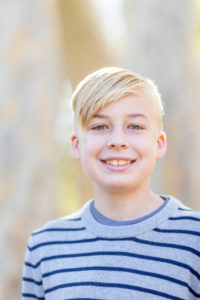 fall portraits at vasona park with a young boy with blonde hair looking at the camera