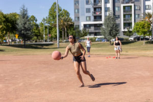 player catching a red kickball