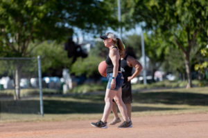 pitcher about to throw kickball and smiling
