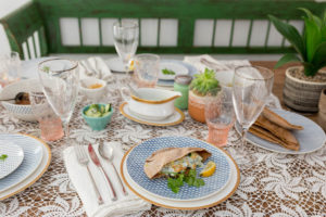 dinner table dressed up with vintage pieces and modern dinnerware