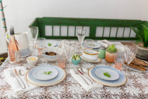 dinner table dressed up with vintage pieces and modern dinnerware