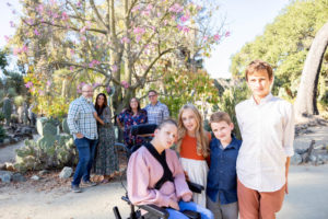 extended family photos at stanford cactus garden with children in the front and the parents in the background