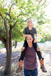 dad with son on his shoulders