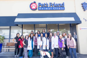 group photo of vet office employees in front of their office