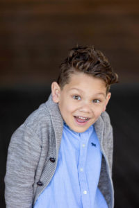little boy model headshot with him laughing