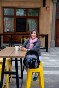 headshot photo of a therapist in downtown san jose drinking local coffee