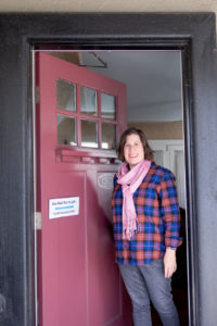 female therapist standing in front of office location