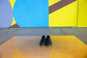 tap shoes in front of a colorful mural for tap dancing portraits