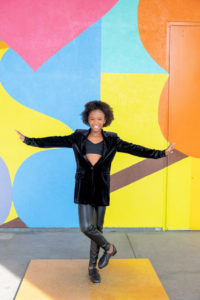 girl standing in front of colorful mural for tap dancing portraits in san jose