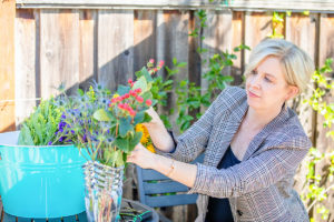 business images of the rule of thirds for your business photography session with a woman putting flowers in a vase