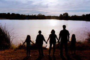family of five looking over a lake in san jose for silhouette photograph