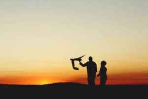 dad and son flying a kite for silhouette photograph