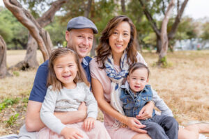 family of four wearing soft pinks for their family photos