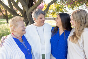 generational photo of moms, granddaughter and grandmas for their family photo