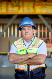 male business headshot on a construction job site