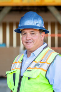 male business headshot on a construction job site