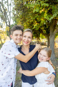 mom with her kids for photo combinations of a family portrait session