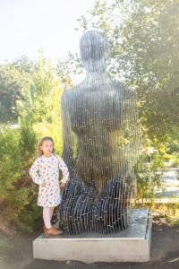 girl with artwork at google visitors center