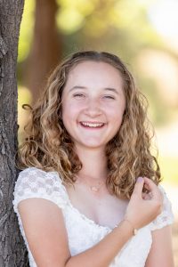 teen girl portrait photo of her looking at the camera and smiling