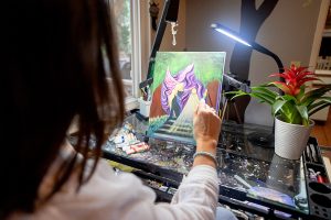 female painter painting for her business branding photography session