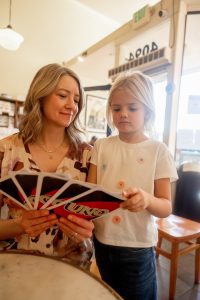 mom and daughter playing uno